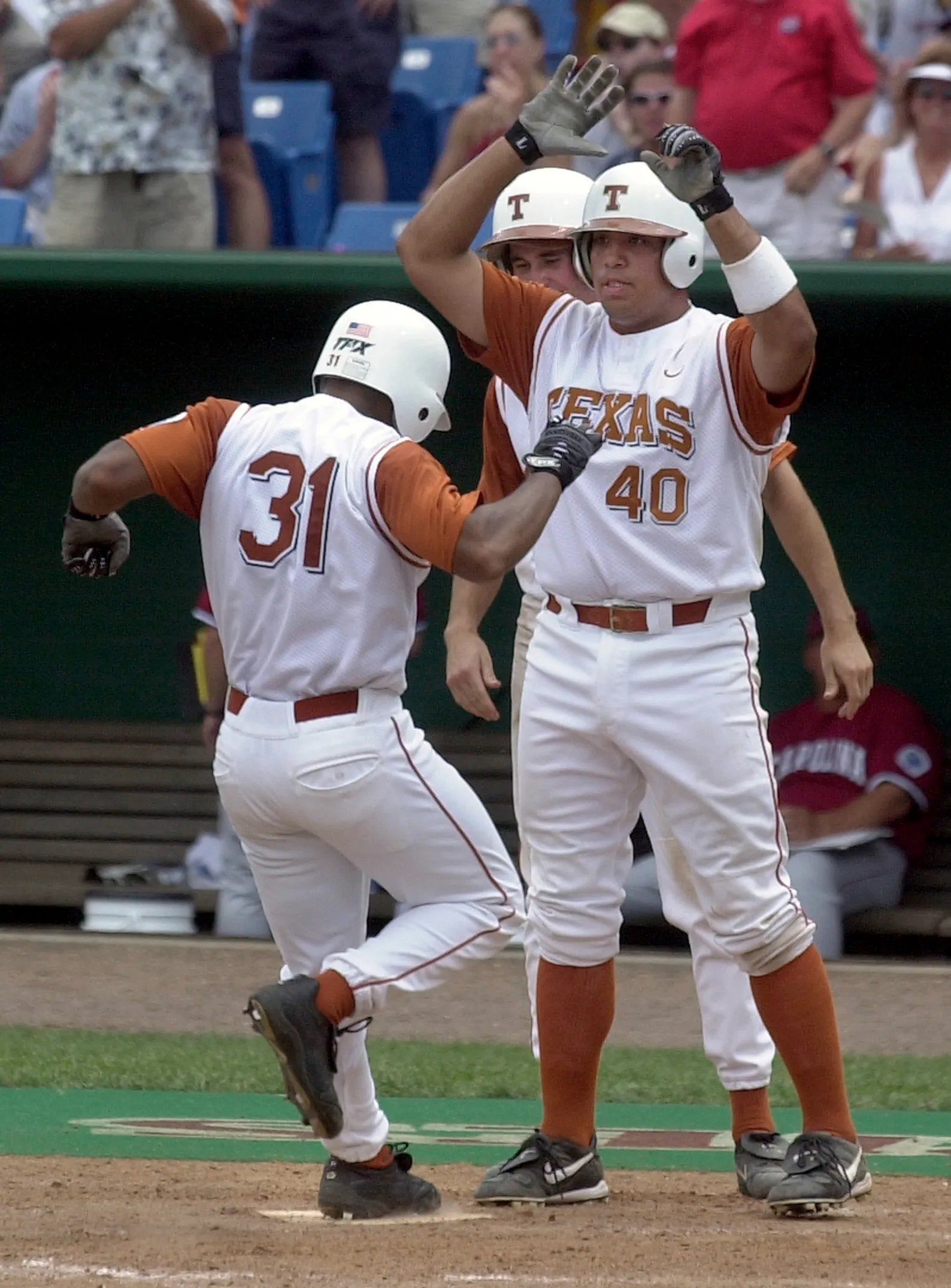 2002 #40 Jeff Ontiveros celebrates #31 Chris Carmichaels home run against South Carolina 2.jpg